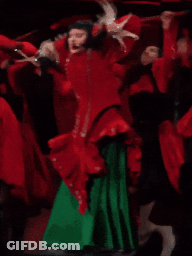 Women Dancing In Red Dress And Green Skirt GIF