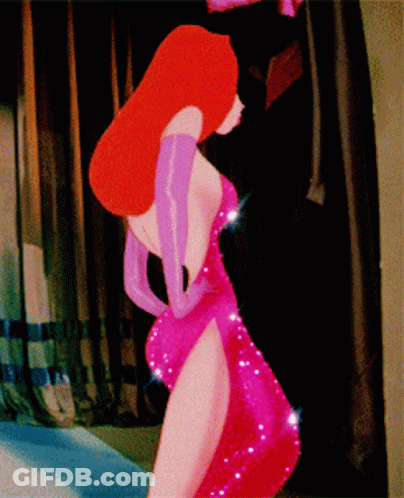 A Woman In A Red Dress And Purple Gloves Is Standing In A Room GIF
