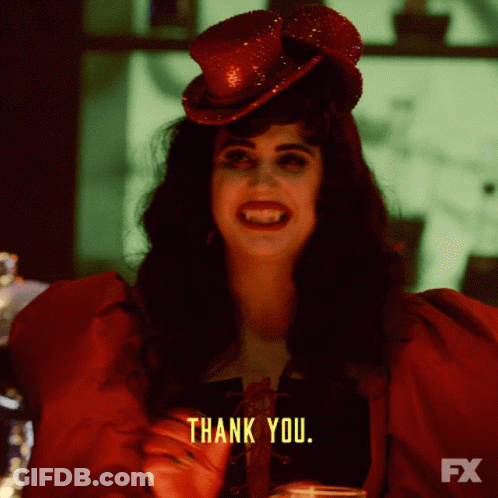 A Woman In A Red Dress And Top Hat Says " Thank You " GIF