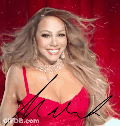 A Woman In A Red Dress Has A Signature On Her Chest That Says Mariah GIF