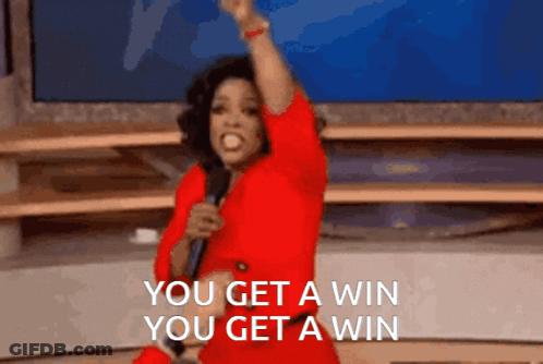 A Woman In A Red Dress Holds A Microphone And Says You Get A Win You Get A Win GIF