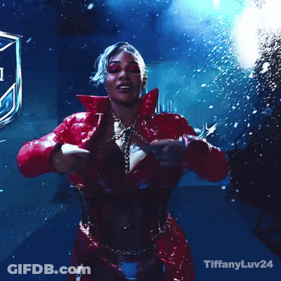 A Woman In A Red Dress Is Dancing With The Words Tiffanyluv24 Below Her GIF
