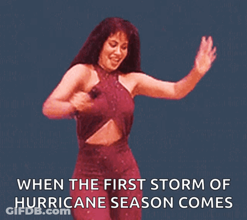A Woman In A Red Dress Is Dancing With The Words " When The First Storm Of Hurricane Season Comes " GIF