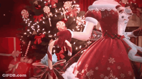 A Woman In A Red Dress Is Holding A Candy Cane . GIF