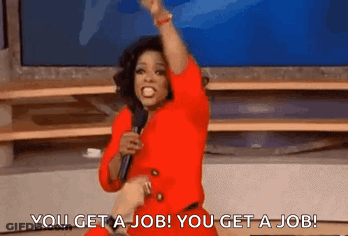 A Woman In A Red Dress Is Holding A Microphone And Saying `` You Get A Job You Get A Job '' . GIF
