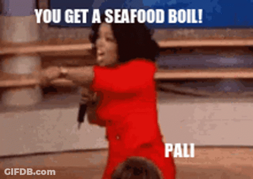 A Woman In A Red Dress Is Holding A Microphone And Saying " You Get A Seafood Boil " GIF