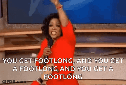 A Woman In A Red Dress Is Holding A Microphone And Says You Get Footlong GIF
