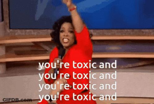 A Woman In A Red Dress Is Holding A Microphone And Says You 'Re Toxic And You 'Re Toxic GIF