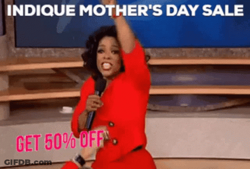 A Woman In A Red Dress Is Holding A Microphone In Front Of A Sign That Says Indice Mother 'S Day GIF