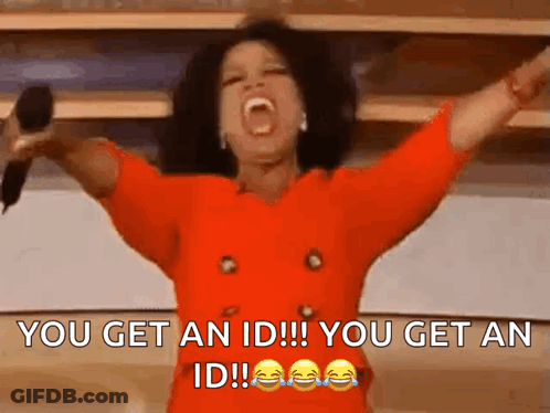 Woman In Red Dress Holding Microphone Arms In Air GIF