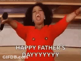 A Woman In A Red Dress Is Holding A Microphone With Her Arms Outstretched And Says Happy Father 'S Day . GIF