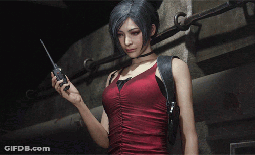 A Woman In A Red Dress Is Holding A Walkie Talkie In Her Hand GIF