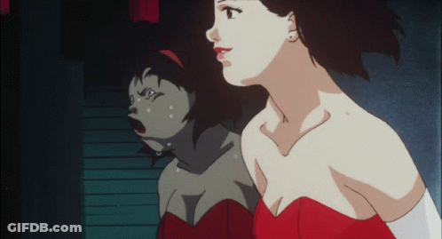 A Woman In A Red Dress Is Looking At Her Reflection In A Mirror GIF