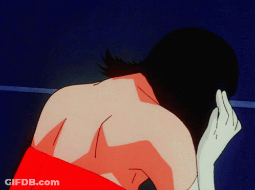 A Woman In A Red Dress Is Looking Down GIF