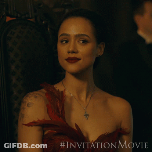 A Woman In A Red Dress Is Sitting In A Chair With The # Invitationmovie Written On The Bottom GIF
