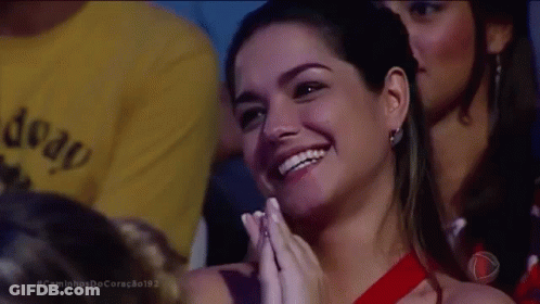 Woman In Red Dress Smiling And Clapping GIF
