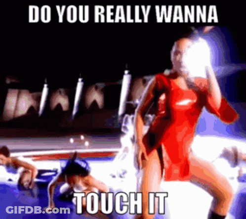 A Woman In A Red Dress Is Standing In Front Of A Car With The Words Do You Really Wanna Touch It . GIF