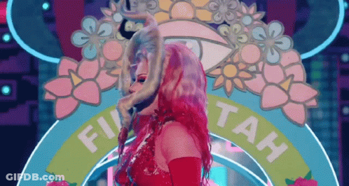 A Woman In A Red Dress Is Standing In Front Of A Sign That Says Fu Tah GIF