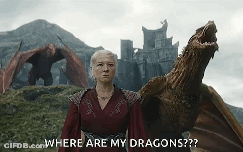 A Woman In A Red Dress Is Standing Next To A Dragon And Asking Where Are My Dragons . GIF