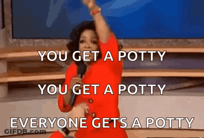 A Woman In A Red Dress Is Standing On A Stage Holding A Microphone And Making A Funny Speech . GIF