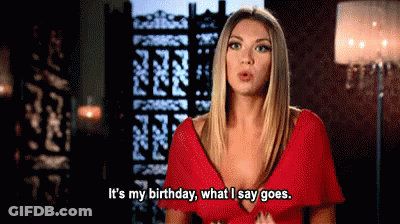 A Woman In A Red Dress Is Talking About Her Birthday . GIF