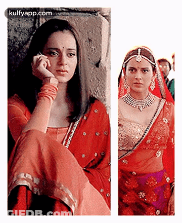 A Woman In A Red Dress Is Talking On A Cell Phone Next To A Woman In A Purple Dress . GIF