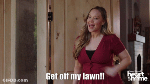 A Woman In A Red Dress Says Get Off My Lawn In Front Of A Door GIF
