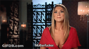 A Woman In A Red Dress Says Motherfucker In Front Of A Screen GIF