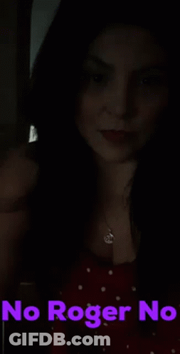 A Woman In A Red Dress Says " No Roger No " In Purple Text GIF