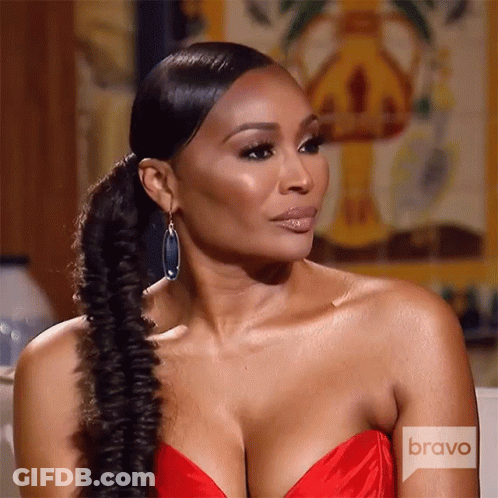 A Woman In A Red Dress With Bravo Written On The Bottom GIF