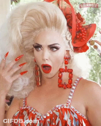 A Woman In A Red Dress With Smirnoff Written In The Background GIF