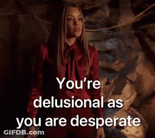 A Woman In A Red Dress With The Words You 'Re Delusional As You Are Desperate Above Her GIF