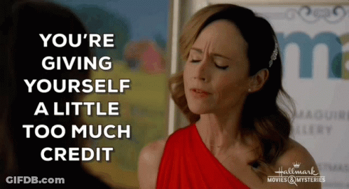 A Woman In A Red Dress With The Words " You 'Re Giving Yourself A Little Too Much Credit " GIF