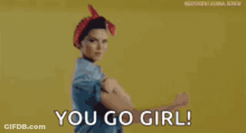 A Woman In A Red Headband Is Flexing Her Muscles And Says `` You Go Girl '' . GIF
