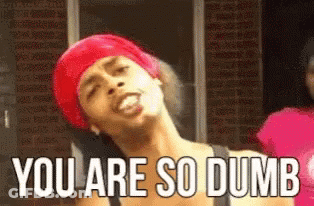 A Woman In A Red Headband Is Making A Funny Face And Saying `` You Are So Dumb '' . GIF
