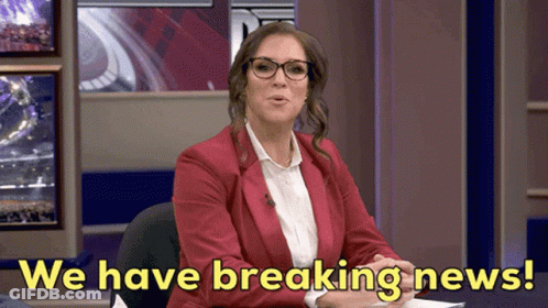 A Woman In A Red Jacket And Glasses Says " We Have Breaking News " GIF