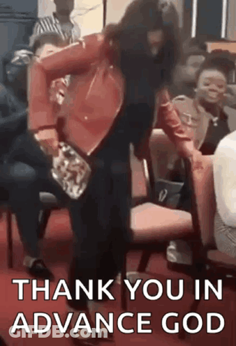 A Woman In A Red Jacket Is Dancing In Front Of A Crowd Of People While Sitting In Chairs . GIF