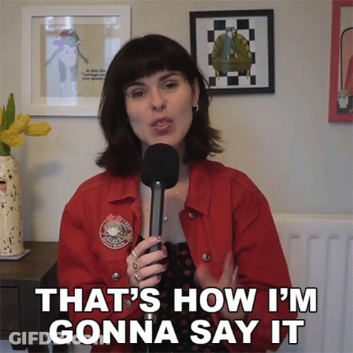 A Woman In A Red Jacket Is Holding A Microphone And Saying " That 'S How I 'M Gonna Say It " GIF