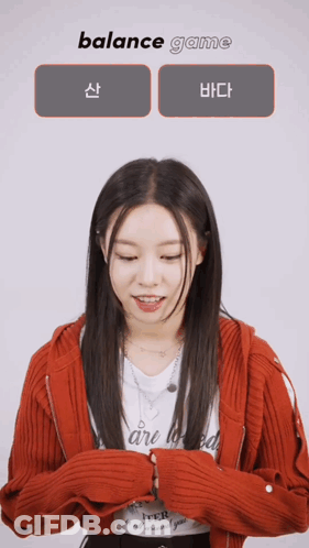 A Woman In A Red Jacket Is Playing A Game Called Balance Game GIF