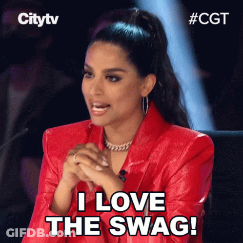 A Woman In A Red Jacket Is Sitting In Front Of A Microphone And Says " I Love The Swag " GIF
