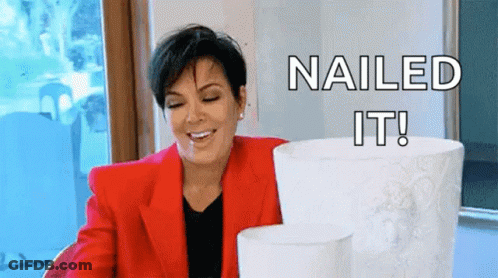 A Woman In A Red Jacket Is Smiling While Holding A Stack Of Toilet Paper Rolls . GIF