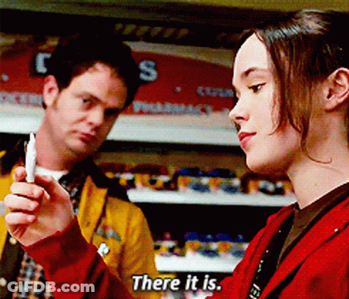 A Woman In A Red Jacket Is Talking To A Man In A Yellow Jacket GIF