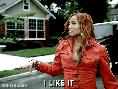 A Woman In A Red Jacket Says " I Like It " In White Letters GIF