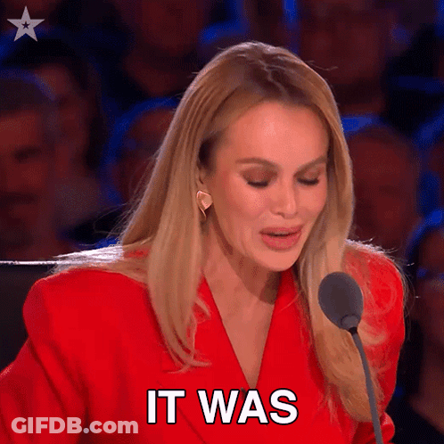 Woman In Red Jacket Speaking Into Microphone GIF