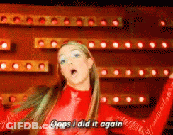 A Woman In A Red Jumpsuit Says Oops I Did It Again GIF