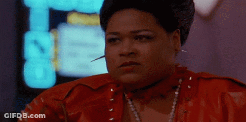 A Woman In A Red Leather Jacket Has A Needle In Her Neck GIF