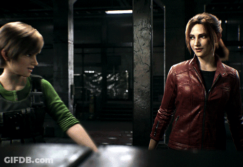 A Woman In A Red Leather Jacket Talks To Another Woman In A Green Shirt GIF