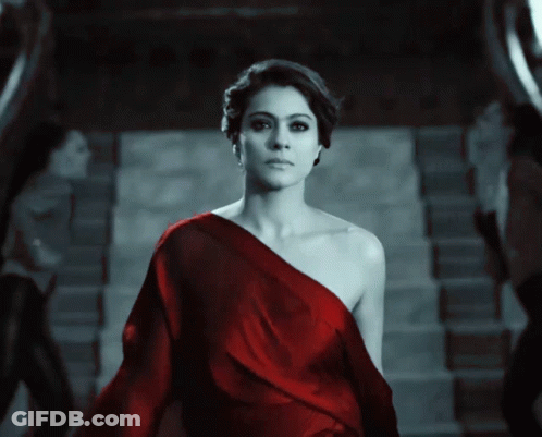 A Woman In A Red Off The Shoulder Dress GIF