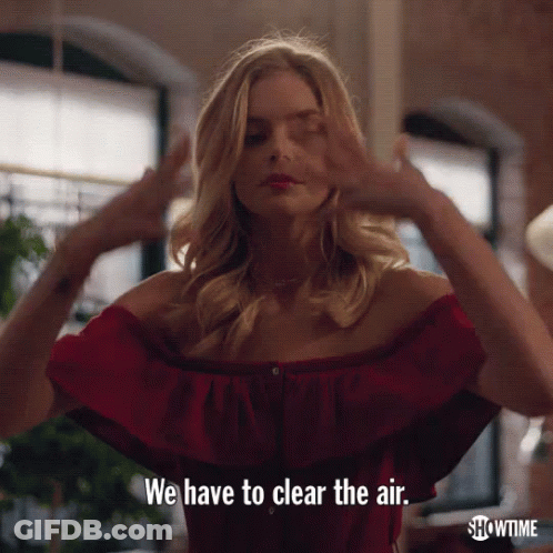 A Woman In A Red Off The Shoulder Top Is Saying We Have To Clear The Air GIF