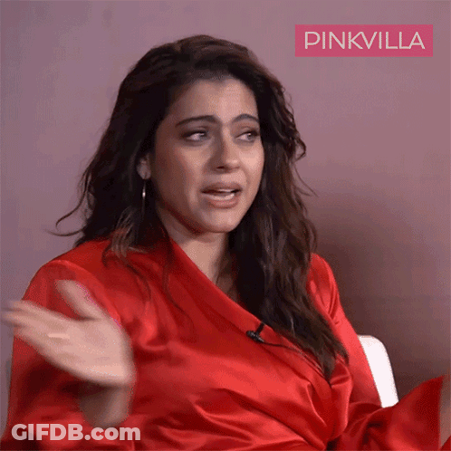 A Woman In A Red Robe With Pinkvilla Written On The Bottom Right GIF
